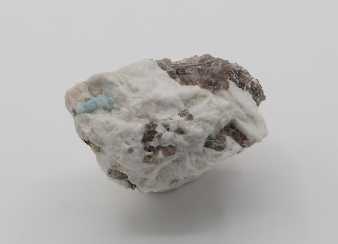 Aquamarine and Heliodor with Hematite, Mica, on Smoky Quartz and Feldspar