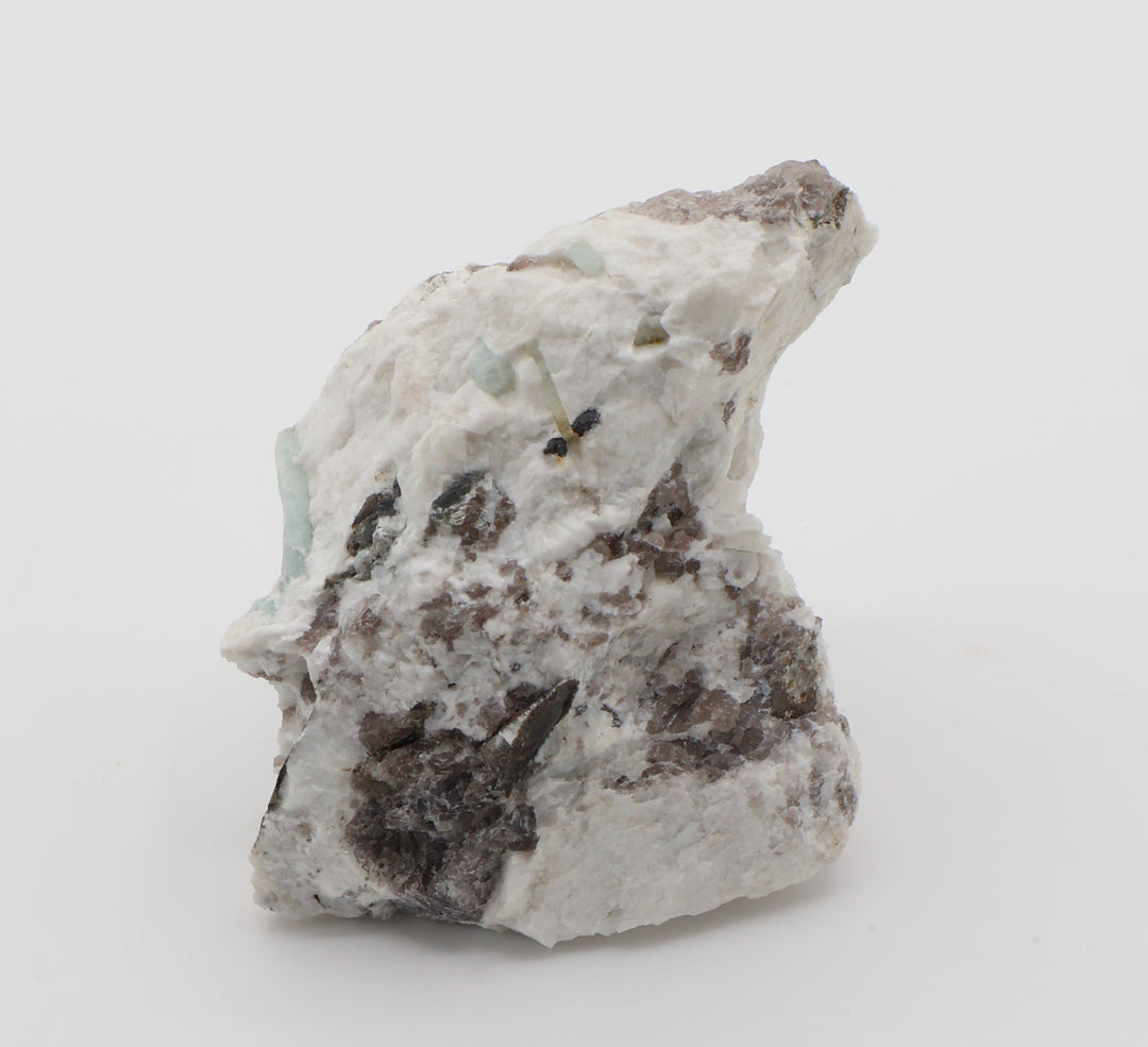 Aquamarine and Bi-Colour Beryl with Hematite, Mica, Smoky Quartz, on Feldspar