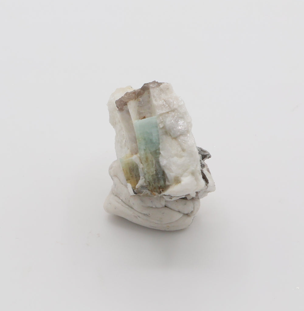 Aquamarine and Bi-Colour Beryl with Hematite, Mica, Smoky Quartz, on Feldspar