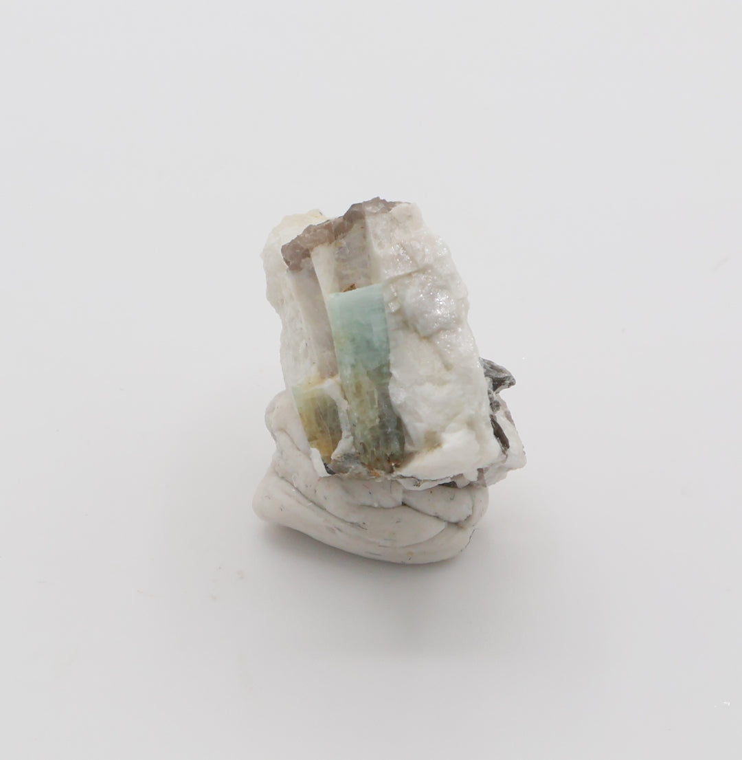 Aquamarine and Bi-Colour Beryl with Hematite, Mica, Smoky Quartz, on Feldspar