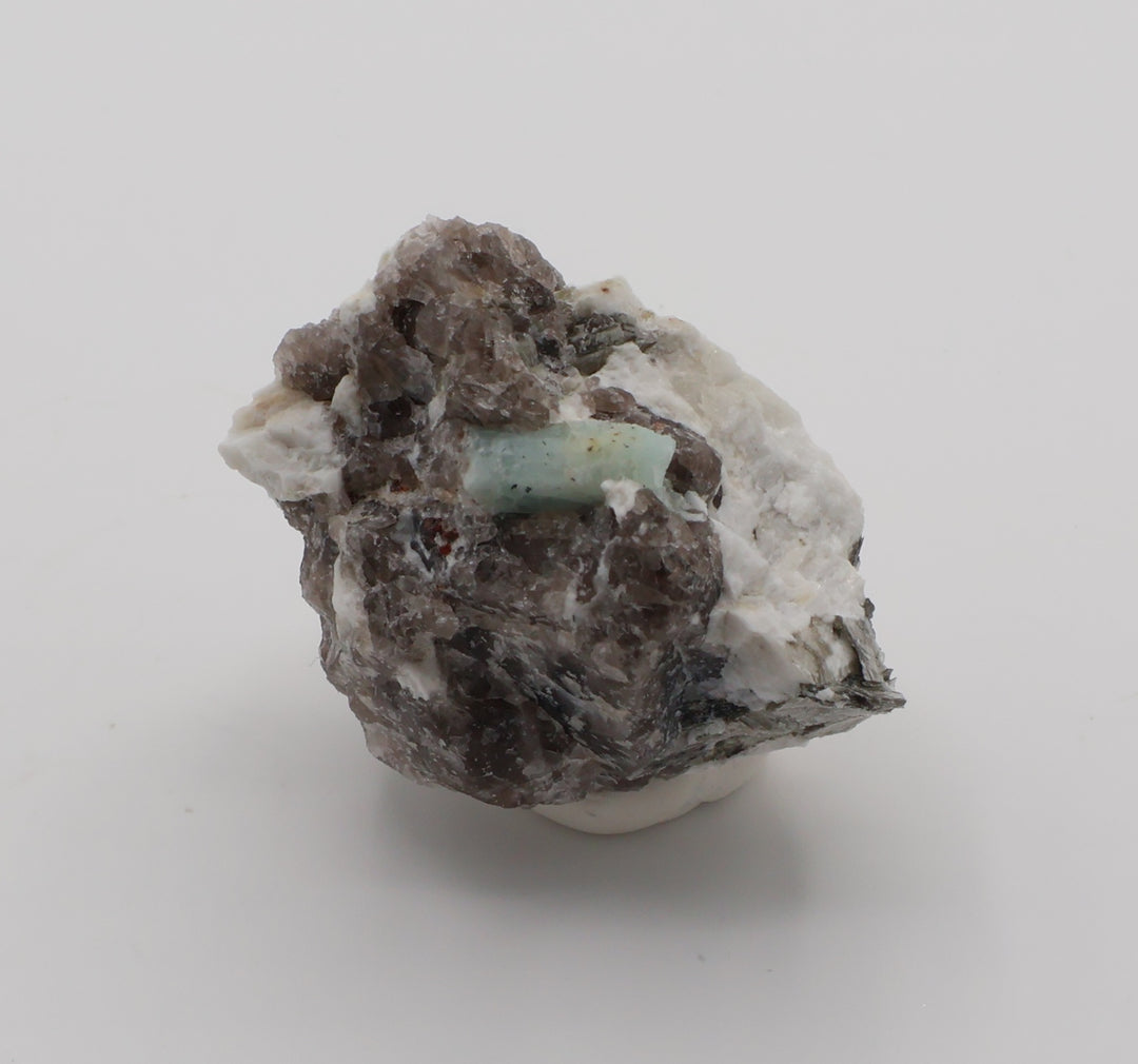 Aquamarine and Spessartine Garnet with Mica, on Smoky Quartz and Feldspar