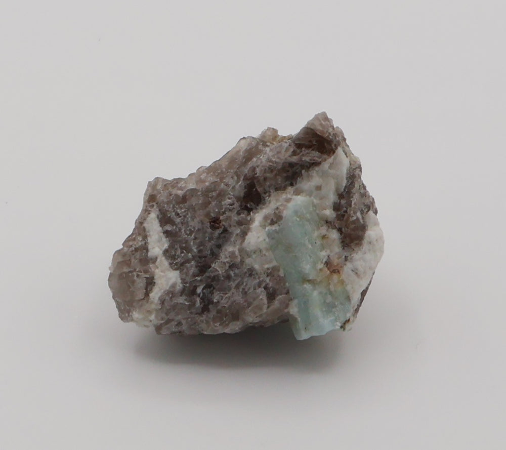 Aquamarine with Spessartine Garnet on Smoky Quartz and Feldspar