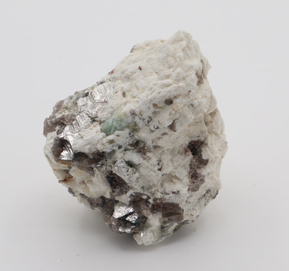 Aquamarine with Spessartine Garnet, Mica, Smoky Quartz, on Feldspar