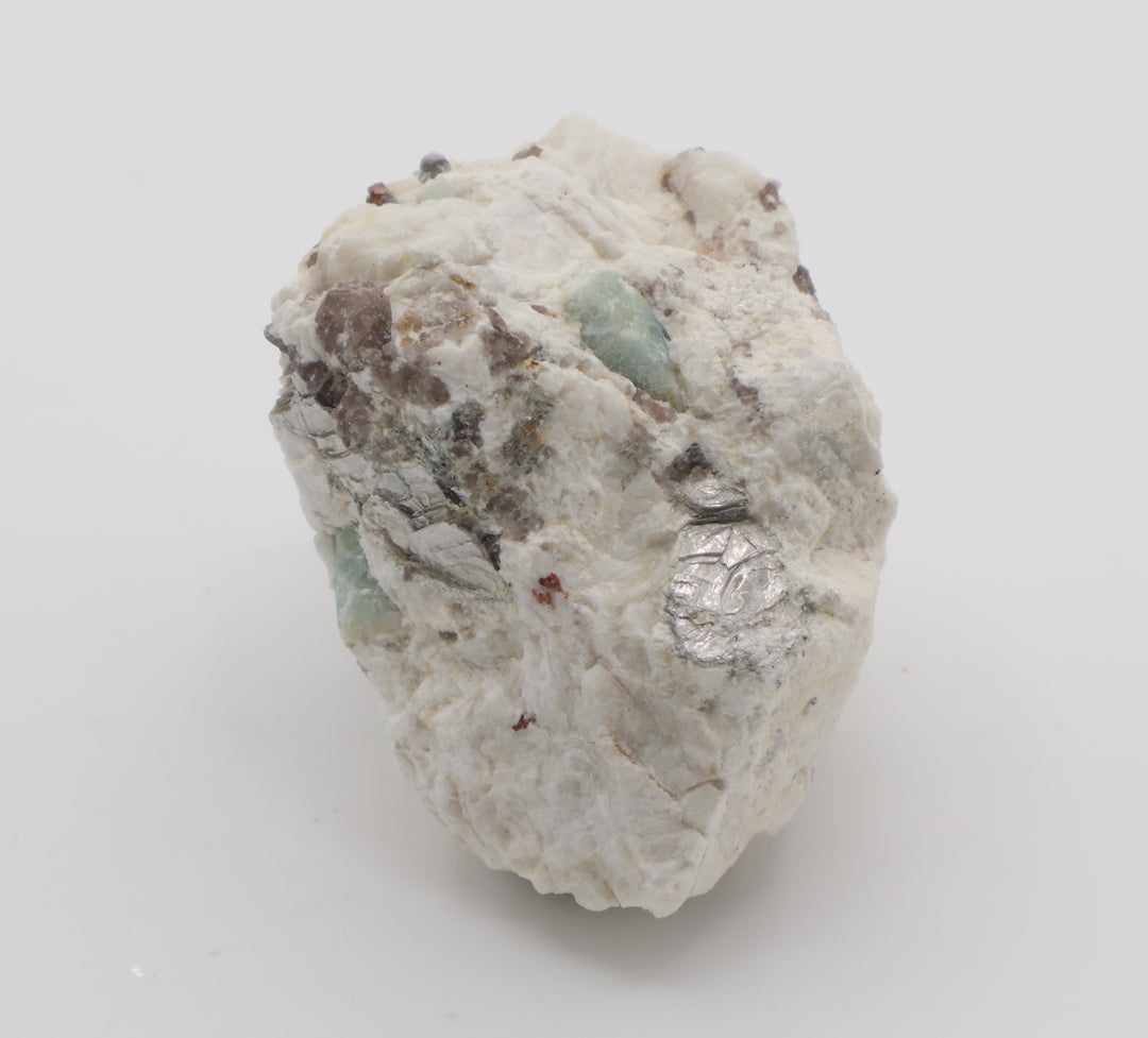 Aquamarine with Spessartine Garnet, Mica, Smoky Quartz, on Feldspar