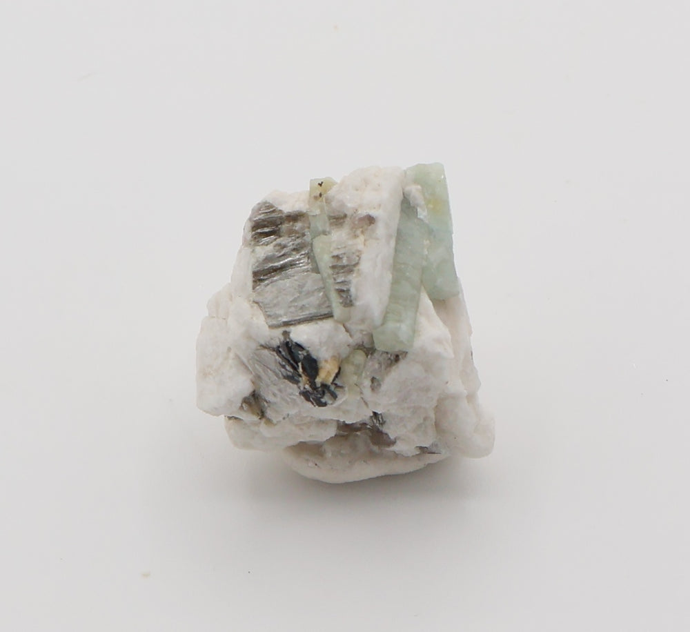 Aquamarine and Heliodor with Mica, Hematite, on Feldspar