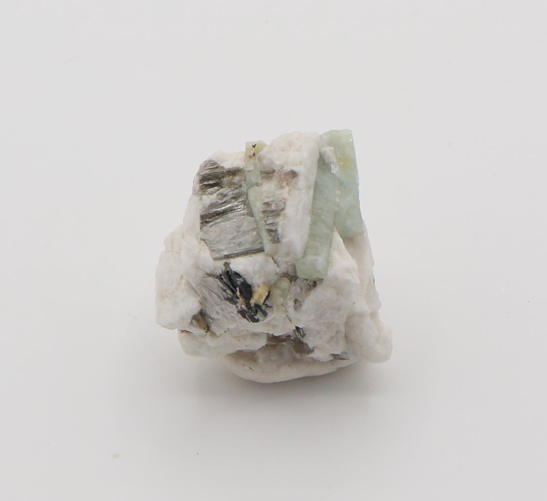 Aquamarine and Heliodor with Mica, Hematite, on Feldspar