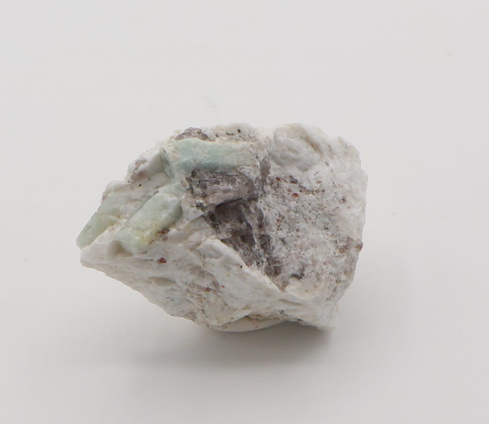 Aquamarine with Spessartine Garnet and Smoky Quartz on Feldspar