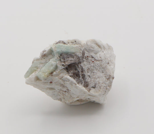 Aquamarine with Spessartine Garnet and Smoky Quartz on Feldspar