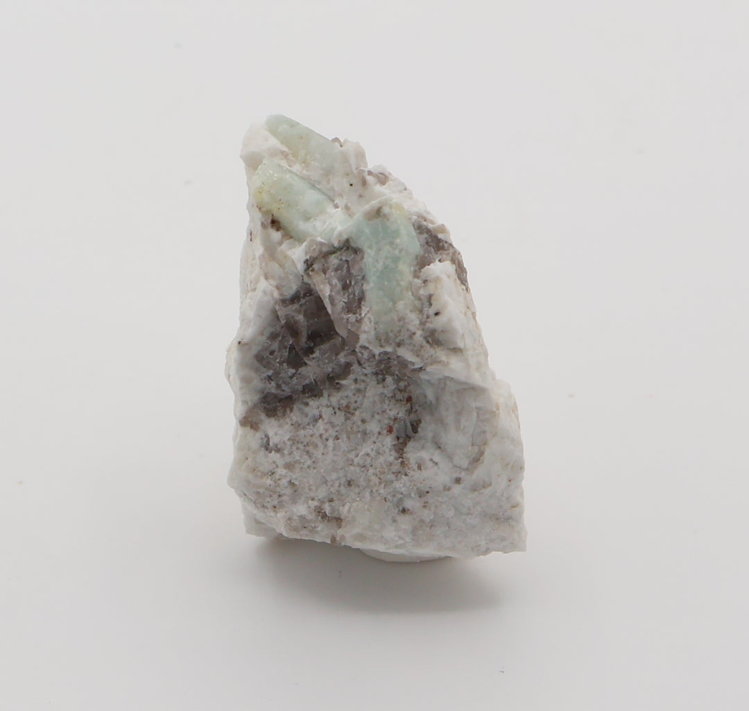 Aquamarine with Spessartine Garnet and Smoky Quartz on Feldspar