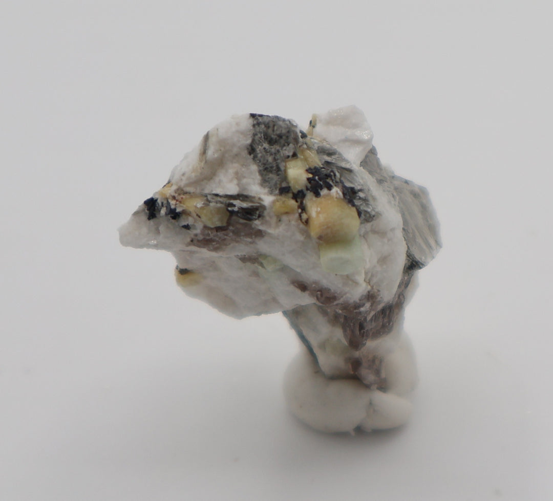 Aquamarine and Heliodor with Hematite, Mica, Smoky Quartz, on Feldspar