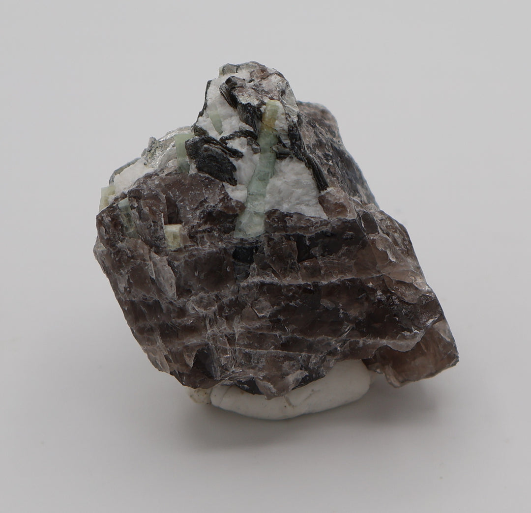 Aquamarine Cluster with Mica on Smoky Quartz and Feldspar