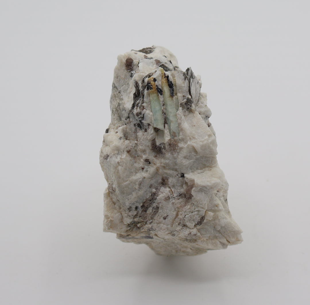 Heliodor Capped Aquamarines with Mica, Hematite, Smoky Quartz, on Feldspar