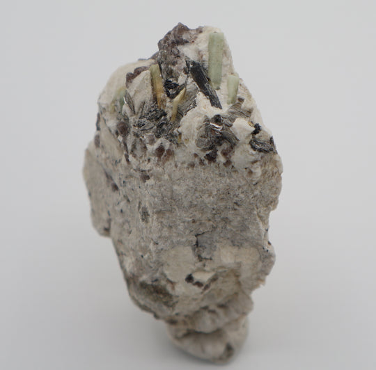 Aquamarine and Bi-Colour Beryl with Hematite, Mica, Smoky Quartz, on Feldspar