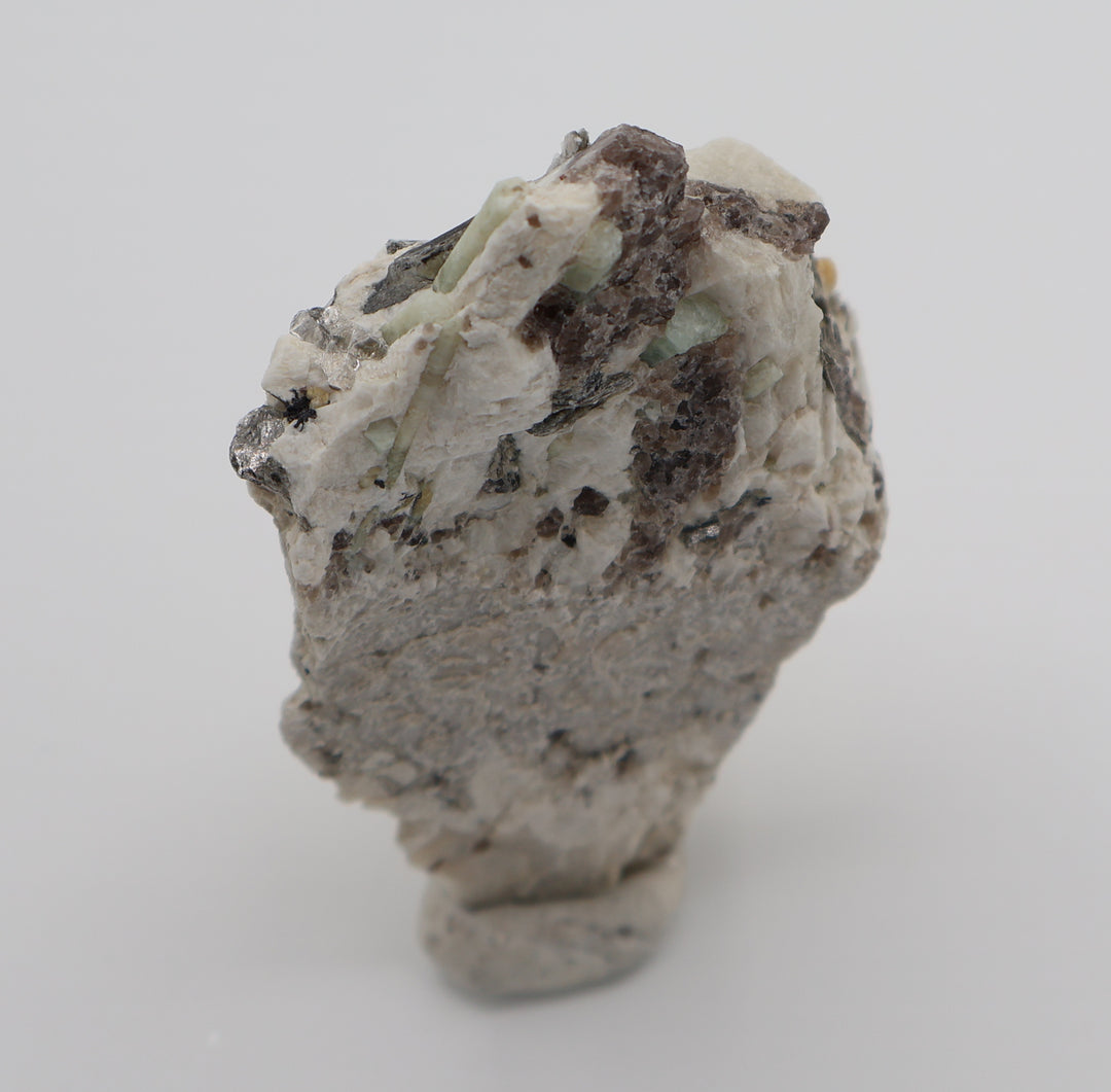 Aquamarine and Bi-Colour Beryl with Hematite, Mica, Smoky Quartz, on Feldspar
