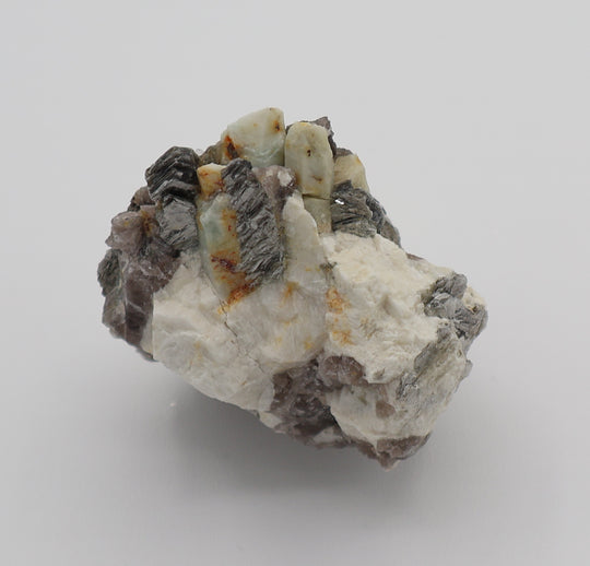 Beryl Cluster with Mica on Smoky Quartz and Feldspar