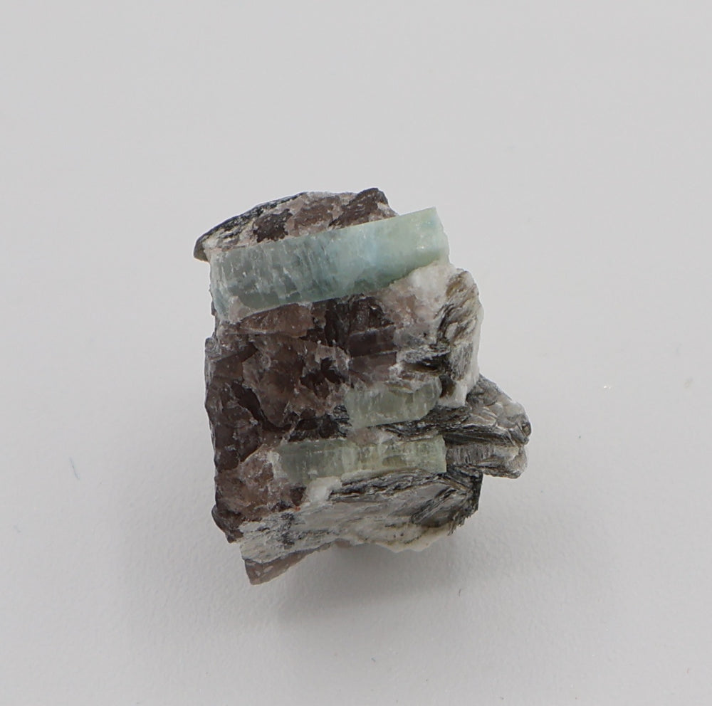 Aquamarine with Mica on Smoky Quartz and Feldspar