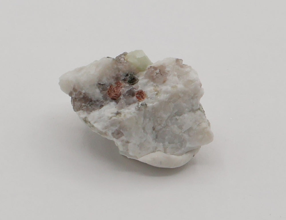 Aquamarine with Spessartine Garnet, Mica, Smoky Quartz, on Feldspar