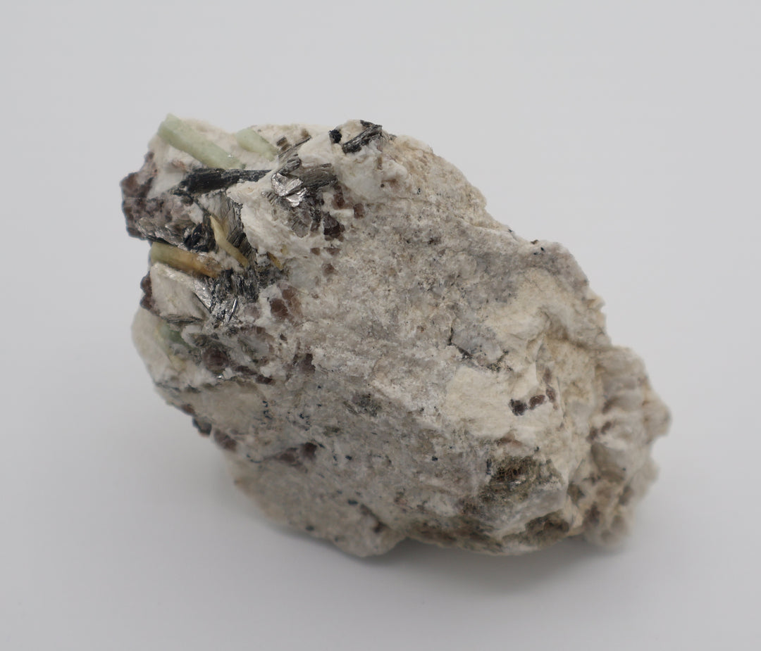 Aquamarine and Bi-Colour Beryl with Hematite, Mica, Smoky Quartz, on Feldspar