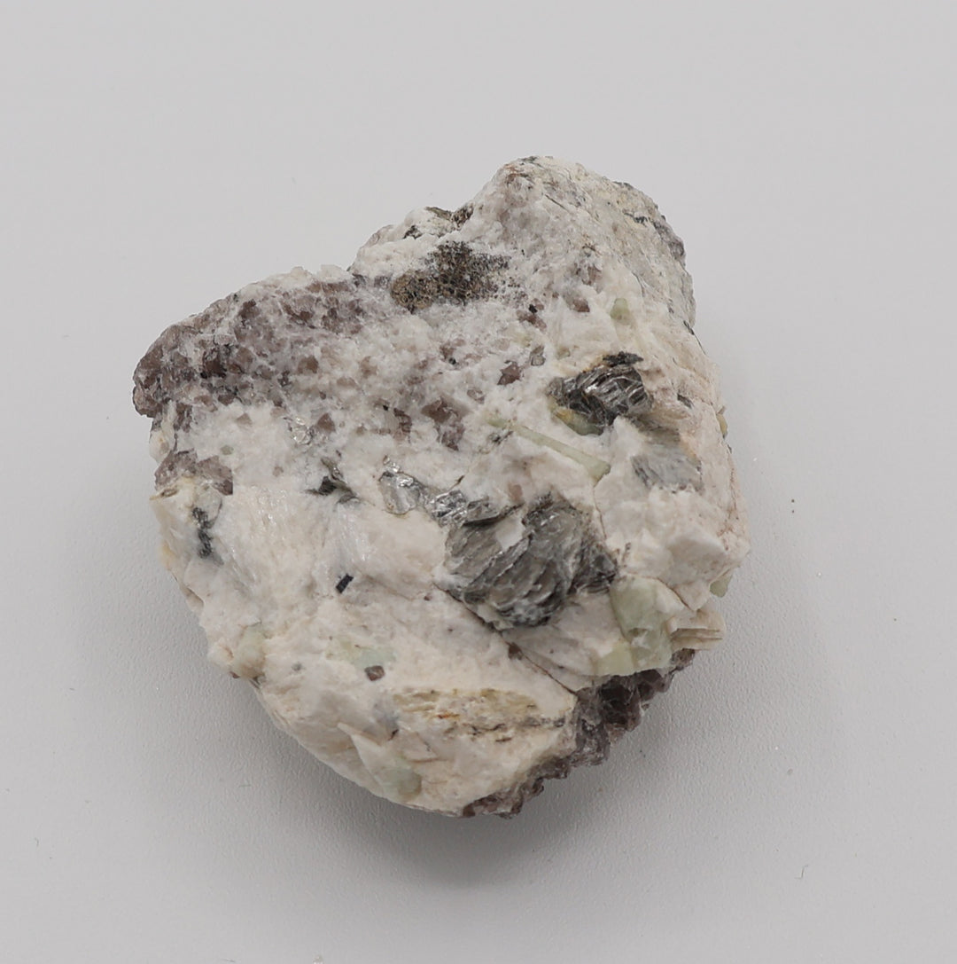 Aquamarine and Heliodor with Mica, Hematite, on Smoky Quartz and Feldspar
