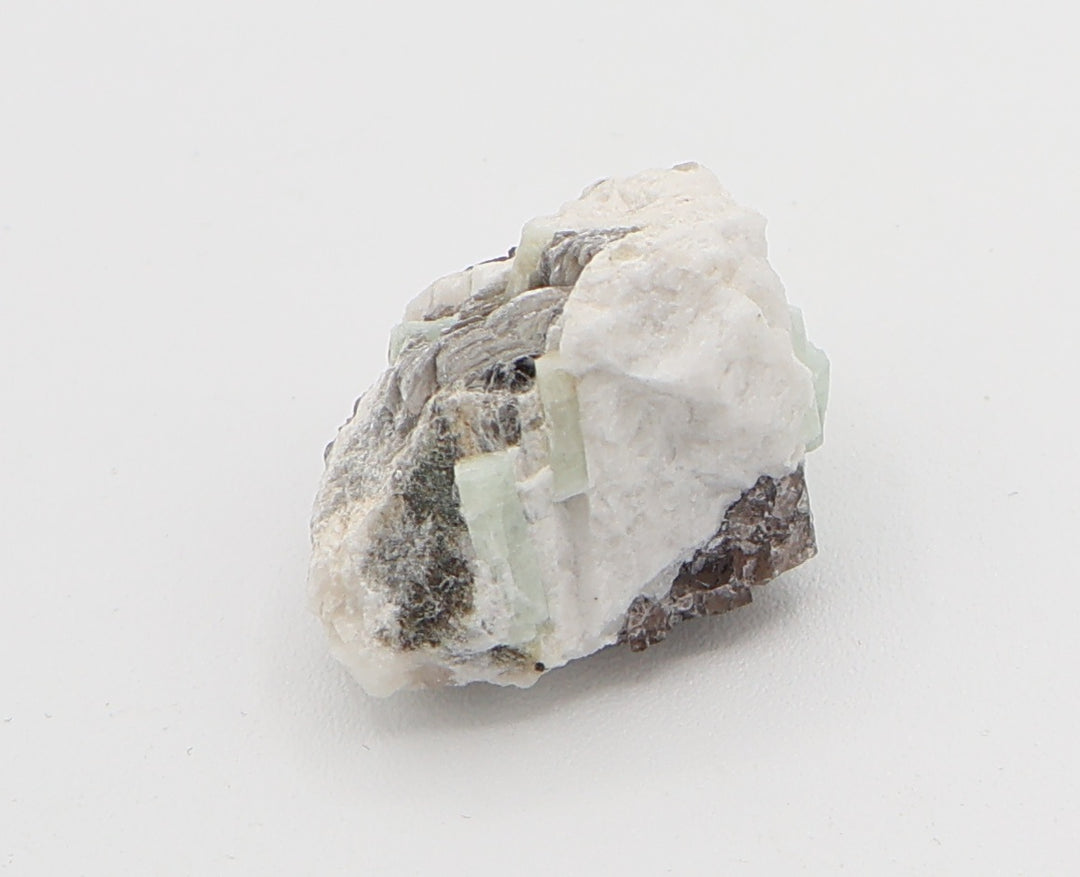 Aquamarine and Bi-Colour Beryl Cluster with Mica, Hematite, on Smoky Quartz and Feldspar