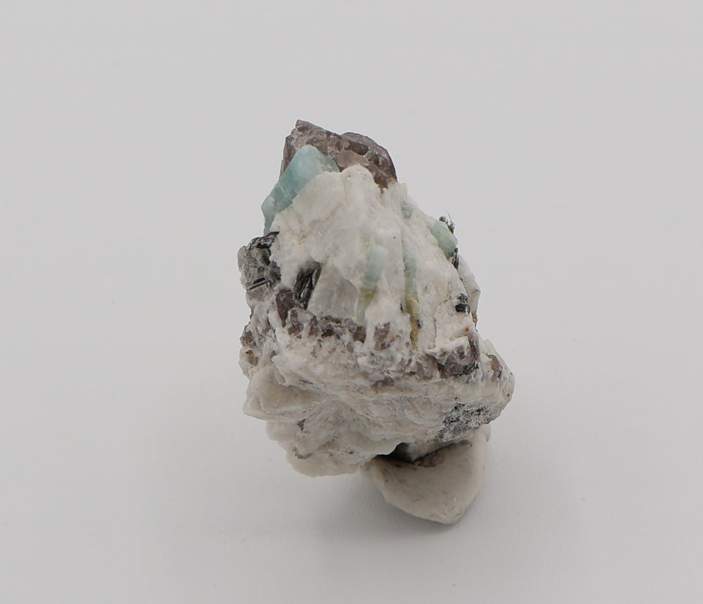 Aquamarine and Bi-Colour Beryl with Mica on Smoky Quartz and Feldspar