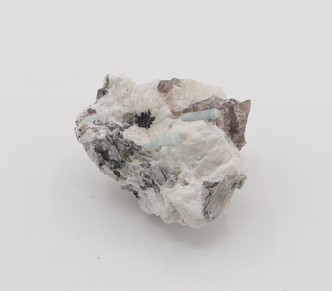 Aquamarine with Hematite, Mica, on Smoky Quartz and Feldspar