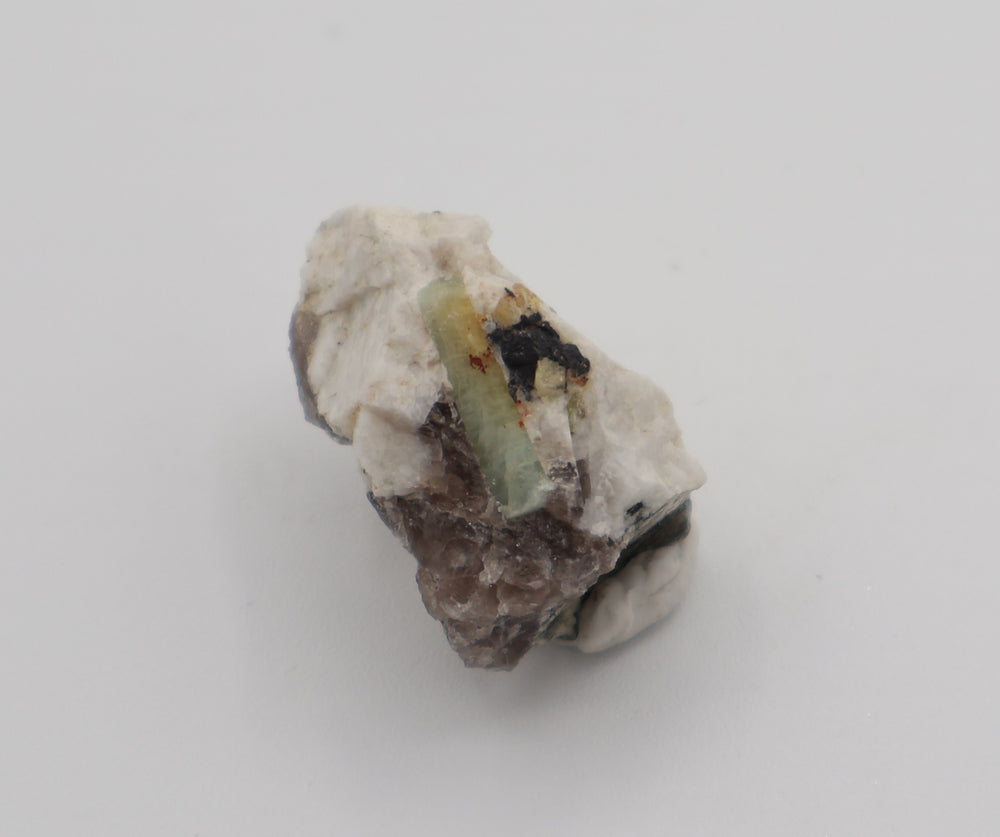 Bi-Colour Beryl with Hematite on Smoky Quartz and Feldspar