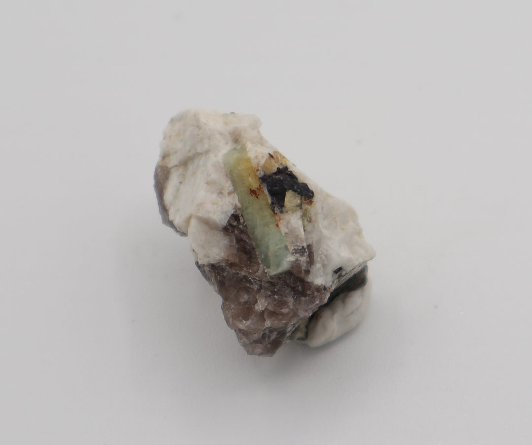 Bi-Colour Beryl with Hematite on Smoky Quartz and Feldspar