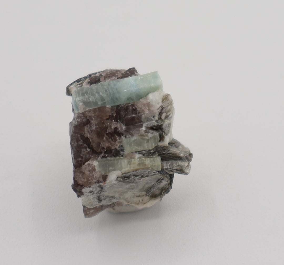 Aquamarine with Mica on Smoky Quartz and Feldspar